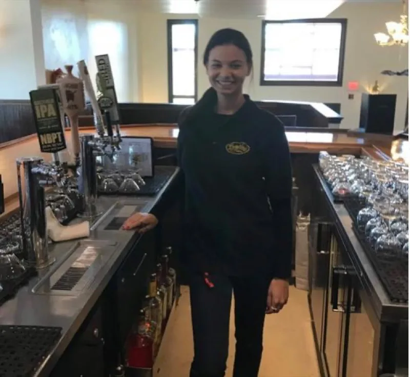Bar area at Bridge View Grill with taps and glassware