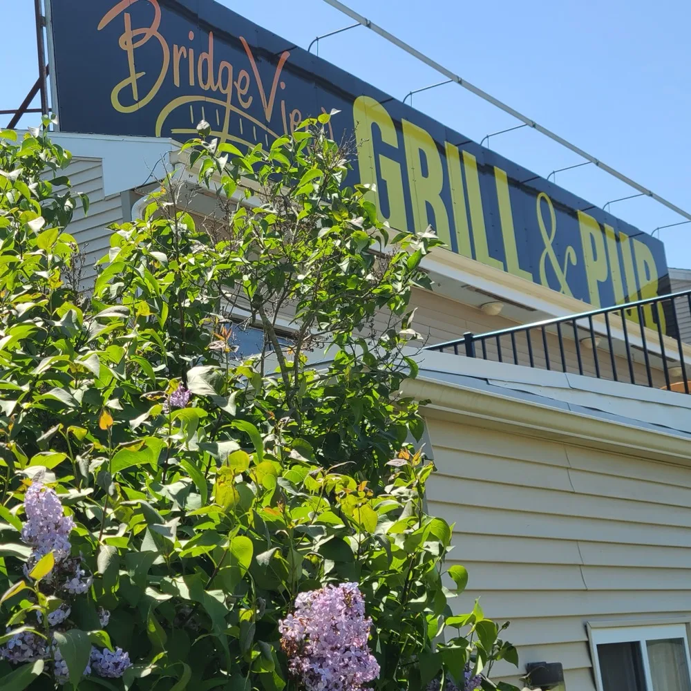 Bridge View Grill & Pub rooftop sign on a sunny day